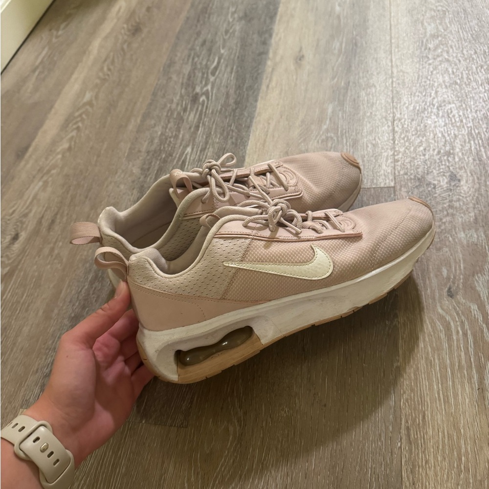 Nike Pink Sneakers with Air Cushioning and Layered Sole